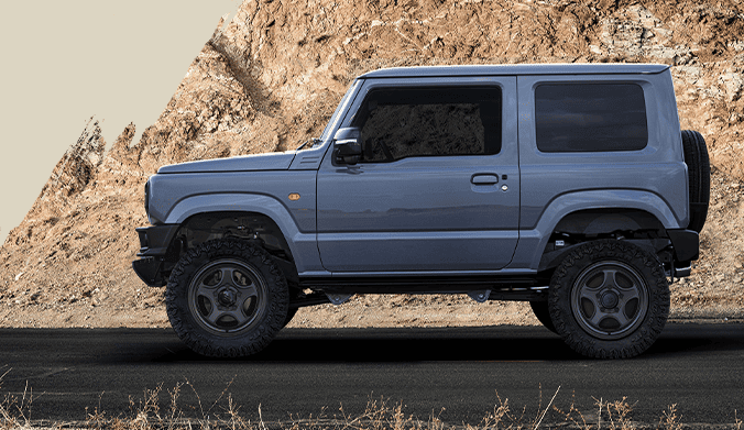 Suzuki Jimny with OFFLESSER OP-S5 wheels in an off-road setting